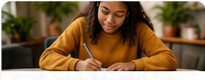 Student writing notes for the College Prep Workshop